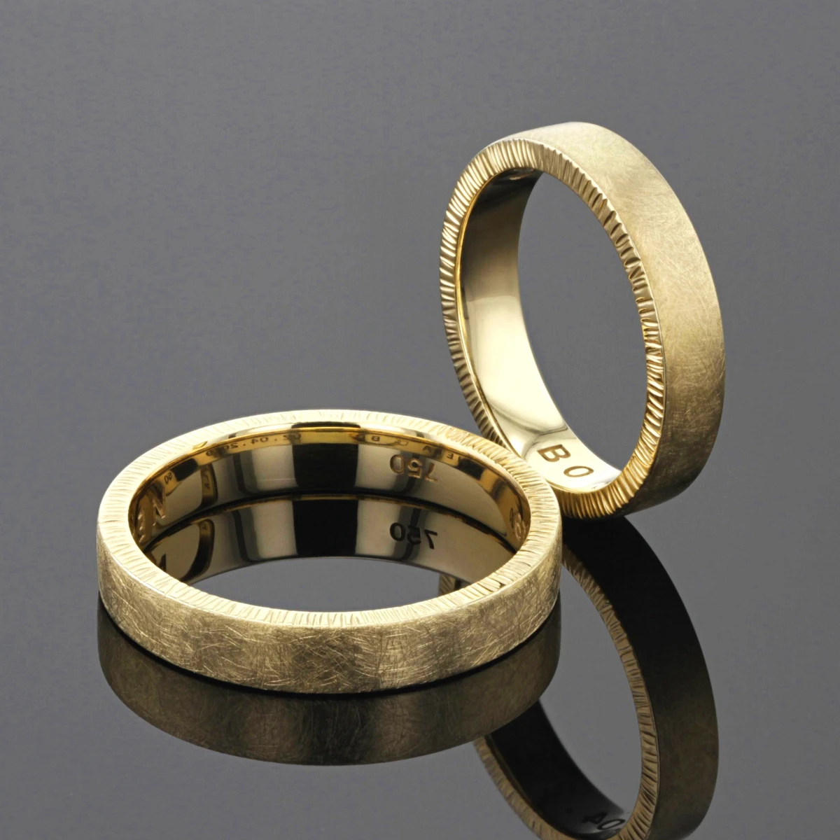 Yellow gold wedding bands with rills hammered on the side