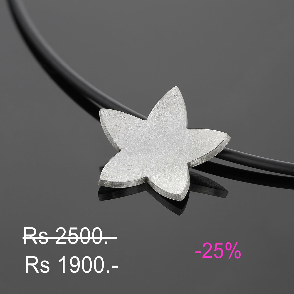 Silver flower shaped pendant on a rubber necklace