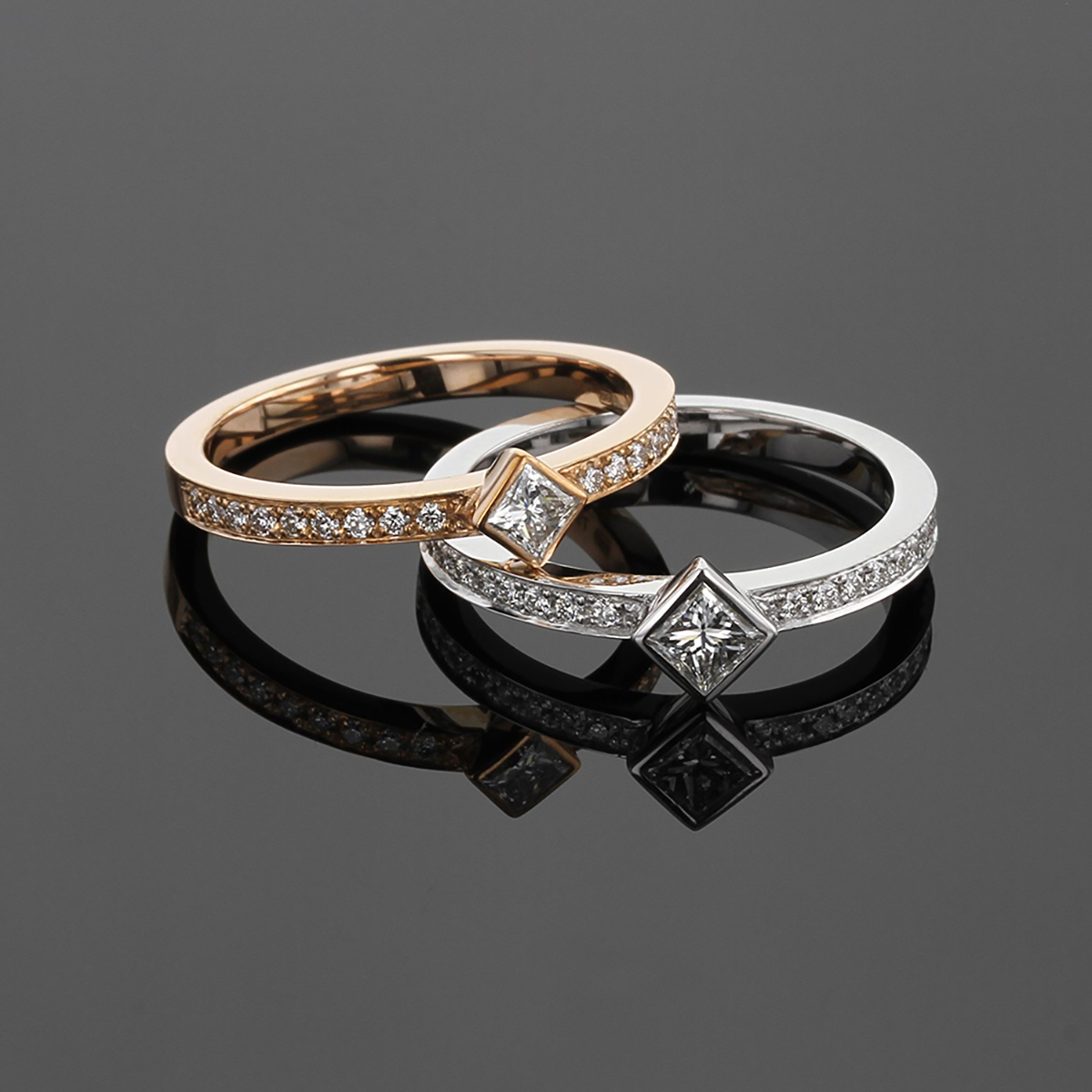 18ct rose and white gold rings with a square shaped center diamond and smaller diamonds on the band.