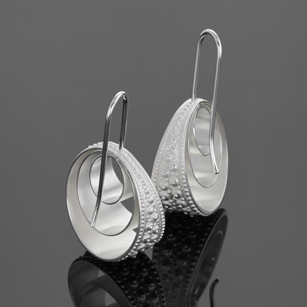 Hook earrings in silver with three hoops within each other