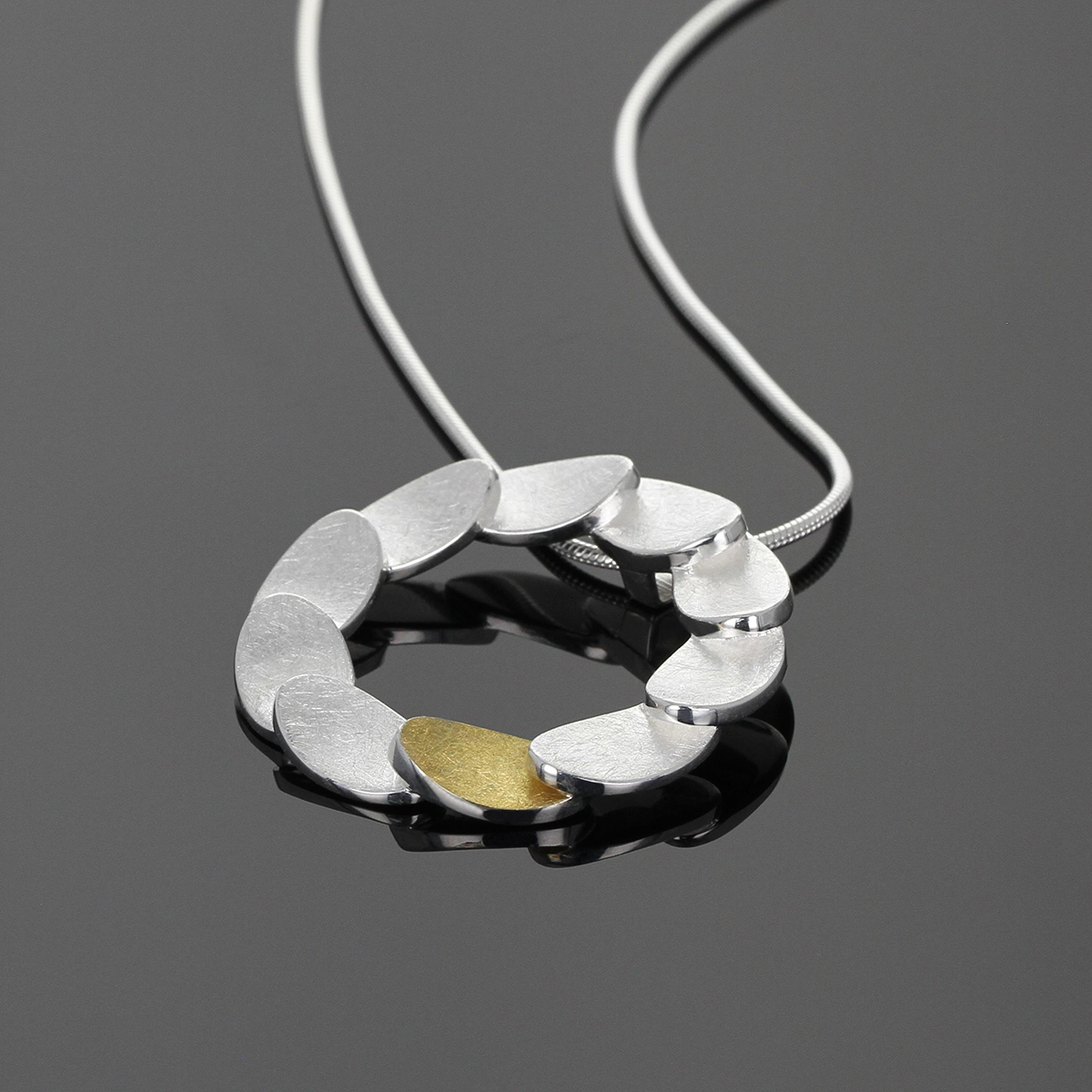 Sterling silver and yellow gold pendant