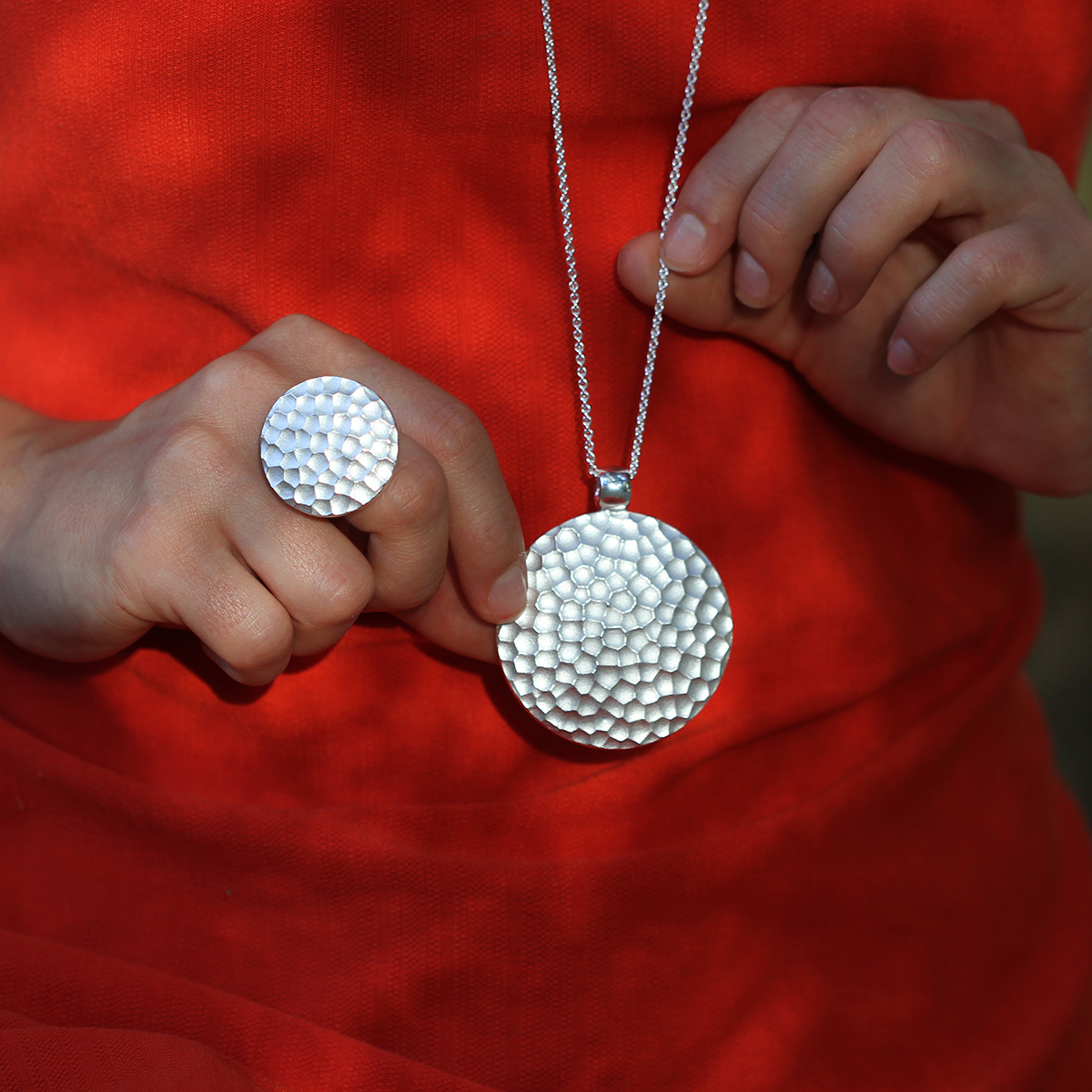 Statement pendant and ring in silver with rock texture