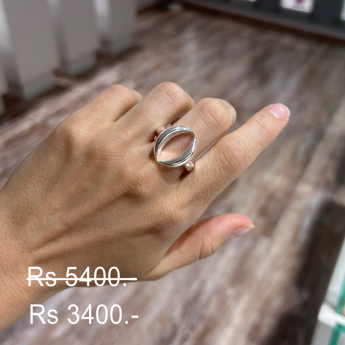 Discounted polished silver ring