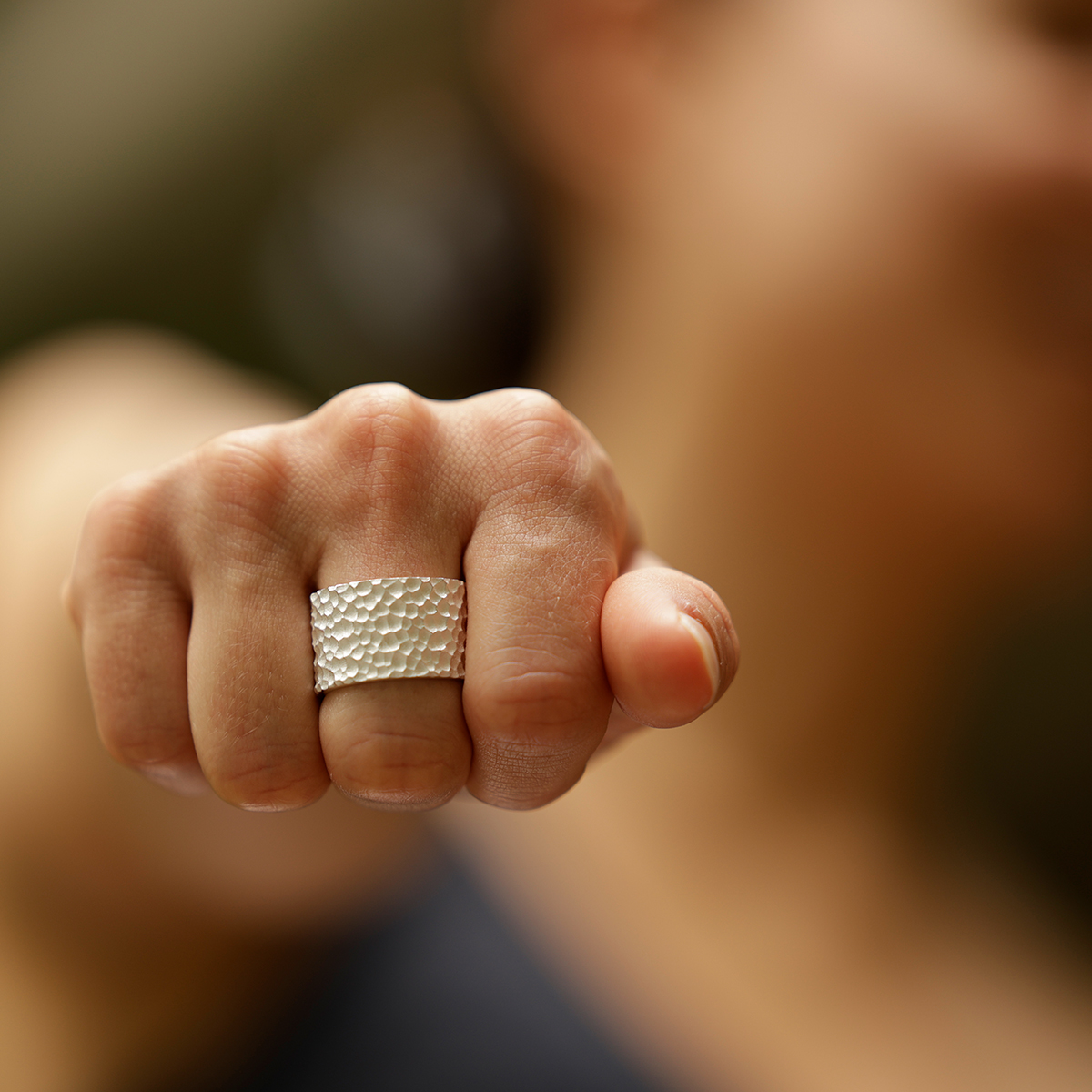 Wide ring in silver with a lava rock texture