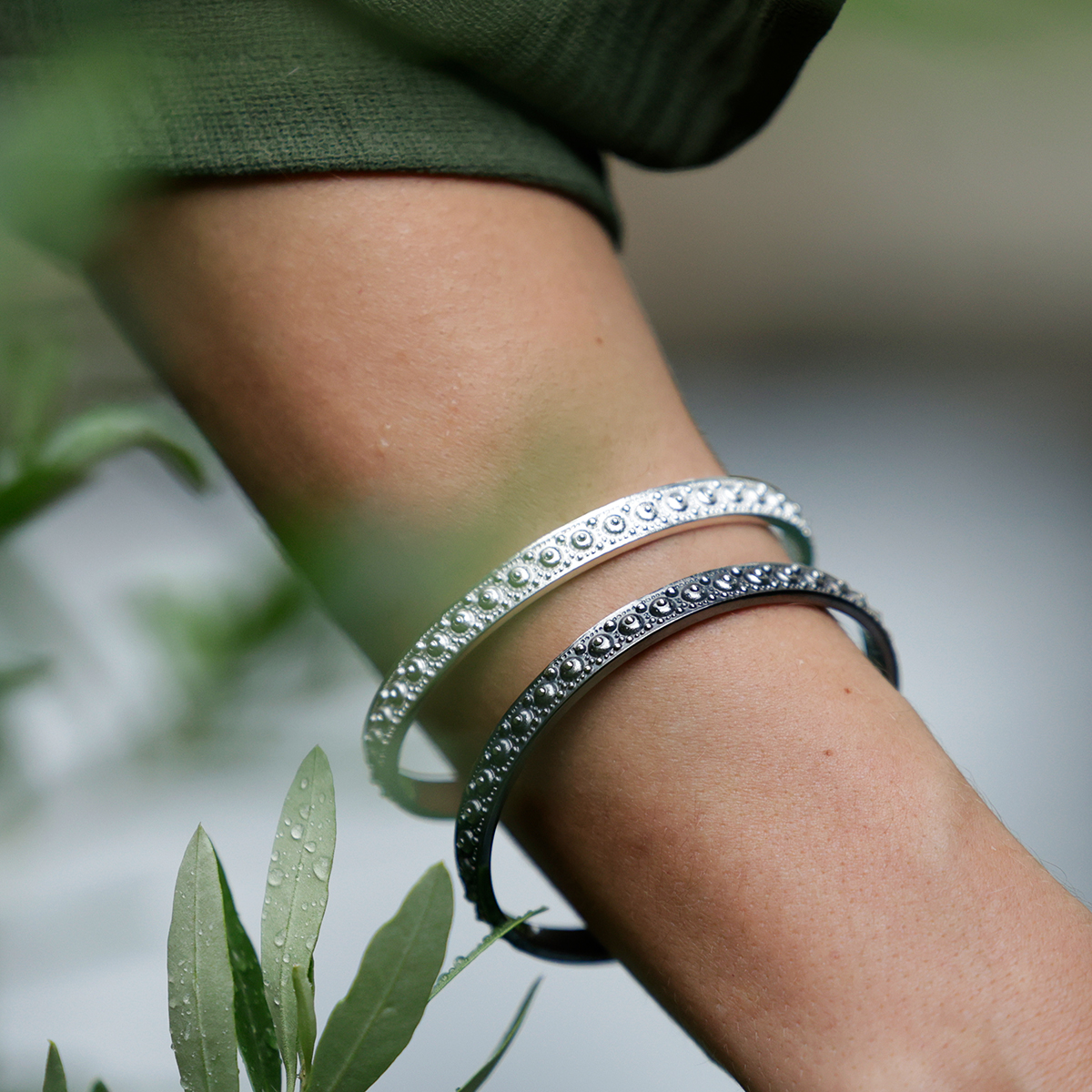 White and black silver bangles with sea urchin texture