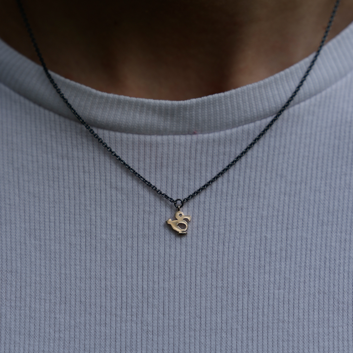 Small dodo in rose gold on a black silver chain