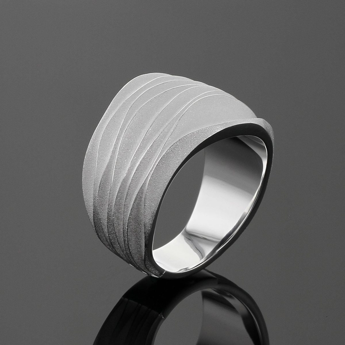 Silver ring with waves