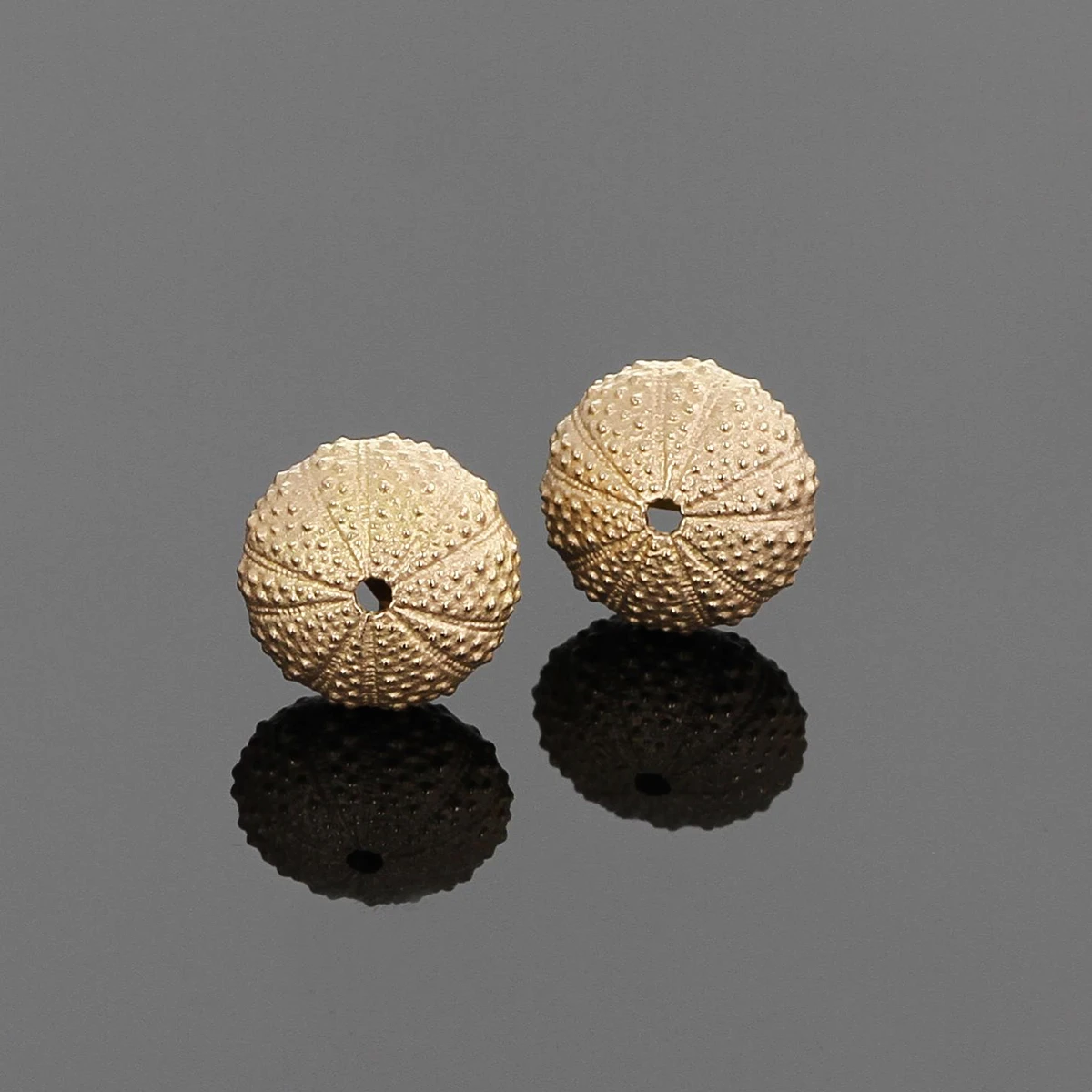 Delicate sea urchin stud earrings in rose gold