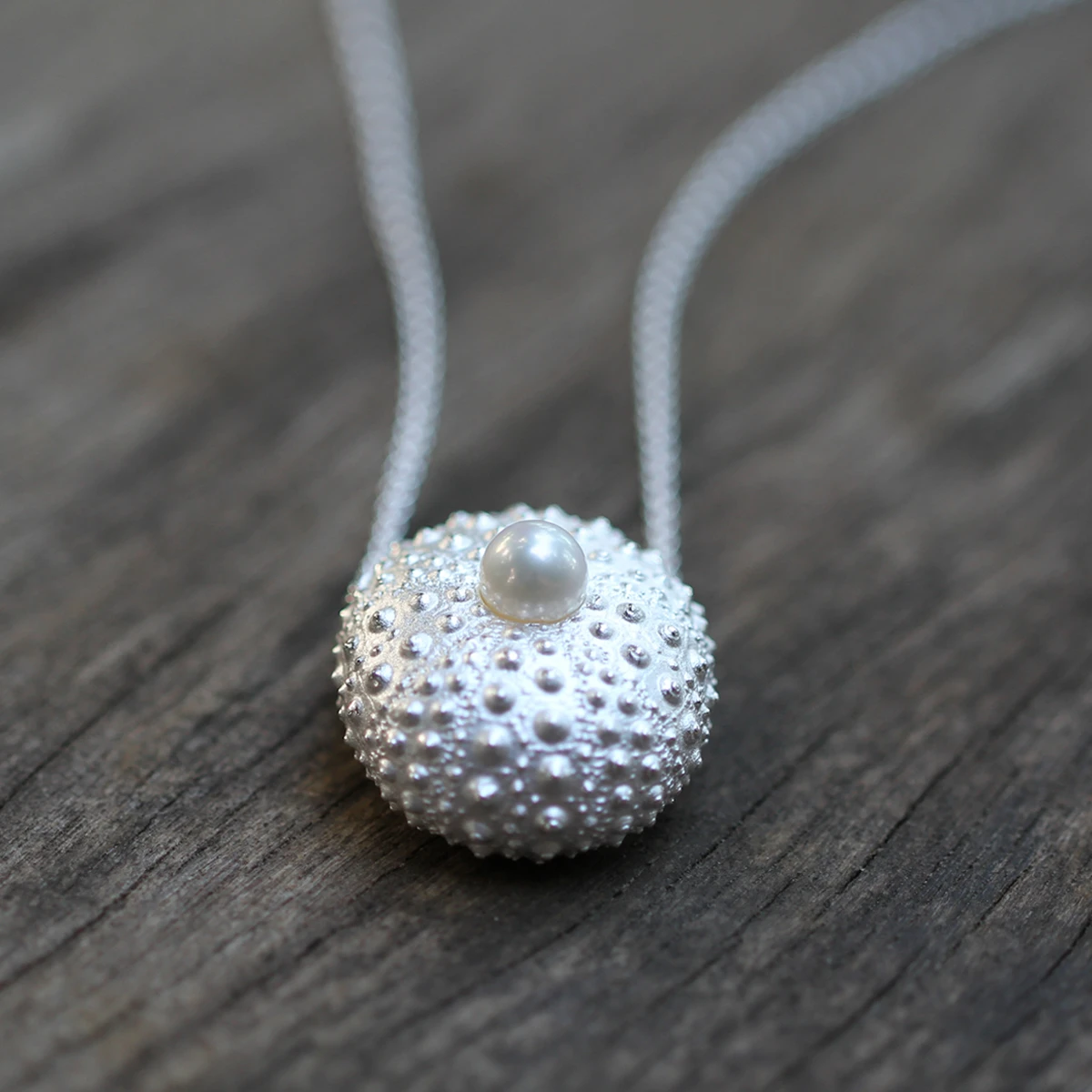 Silver sea urchin pendant with a freshwater pearl