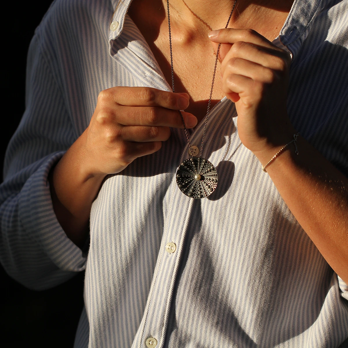 Black silver sea urchin pendant with a freshwater pearl