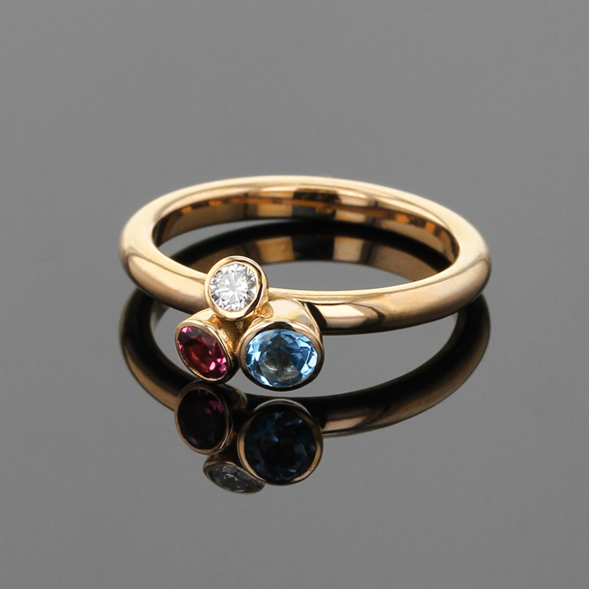 Rose gold ring with Blue Topas, Rhodolite and diamond
