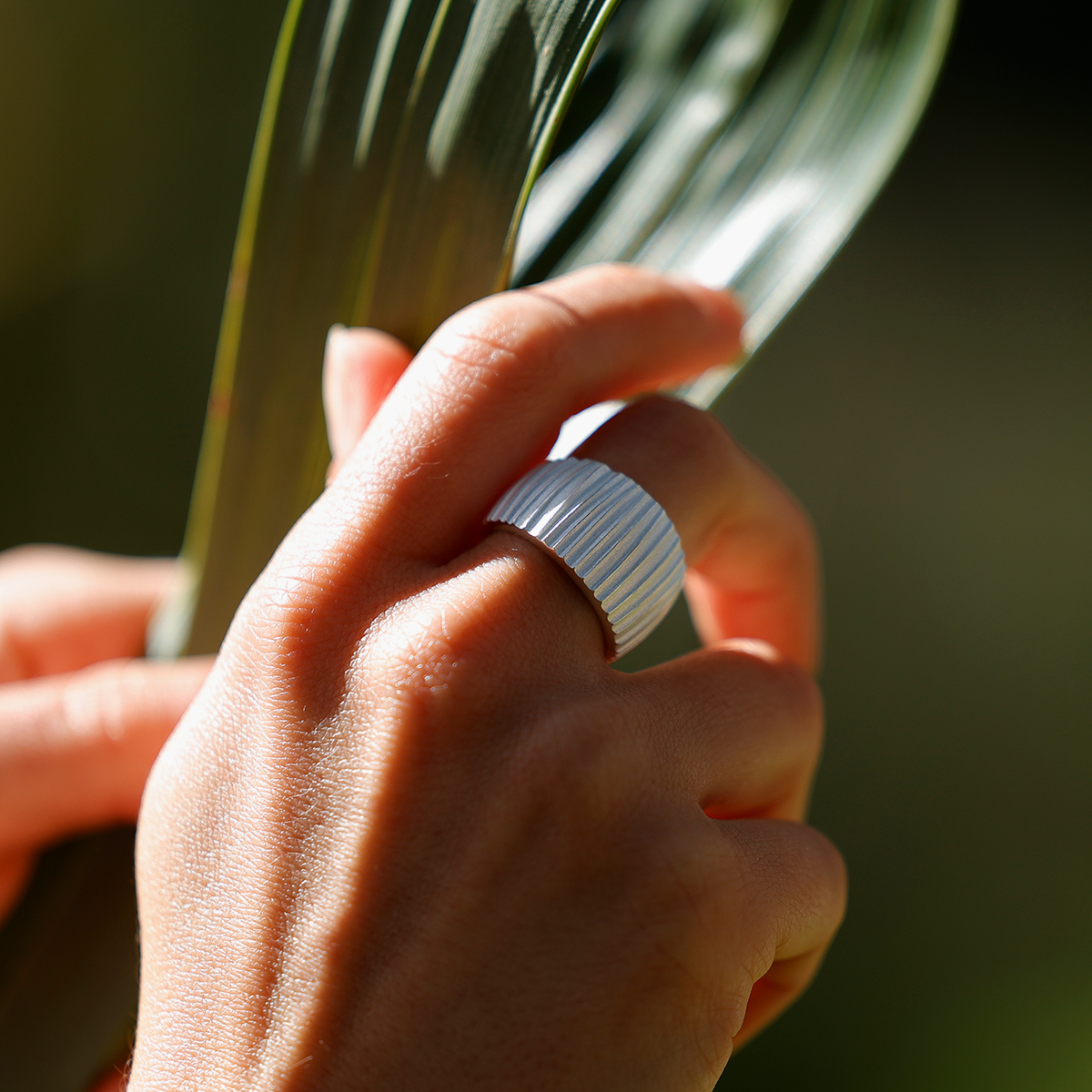 Silver ring with rills