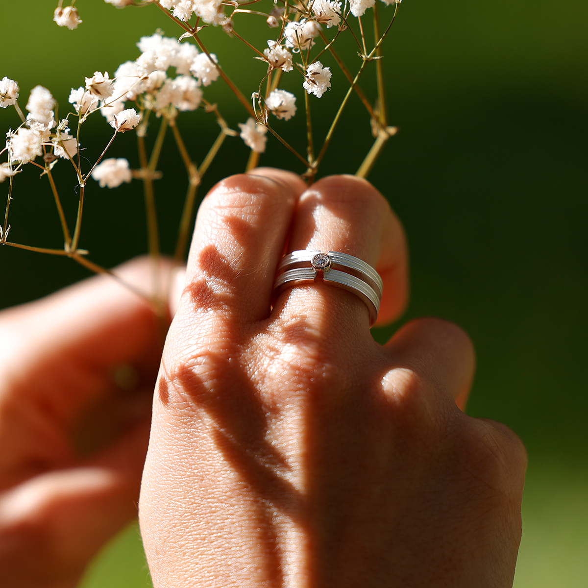 Silver ring with a diamond and gold setting