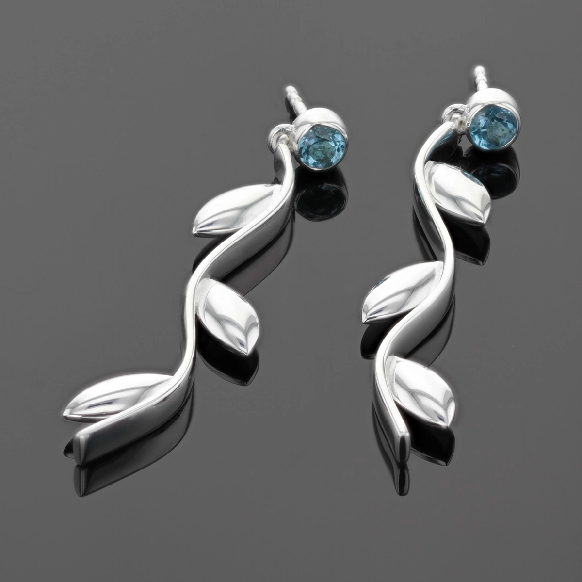 Long silver earrings with leaves and Blue Topas