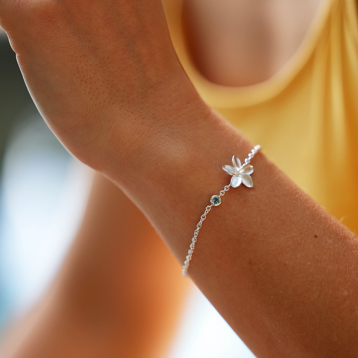 Silver Frangipani bracelet with precious stone