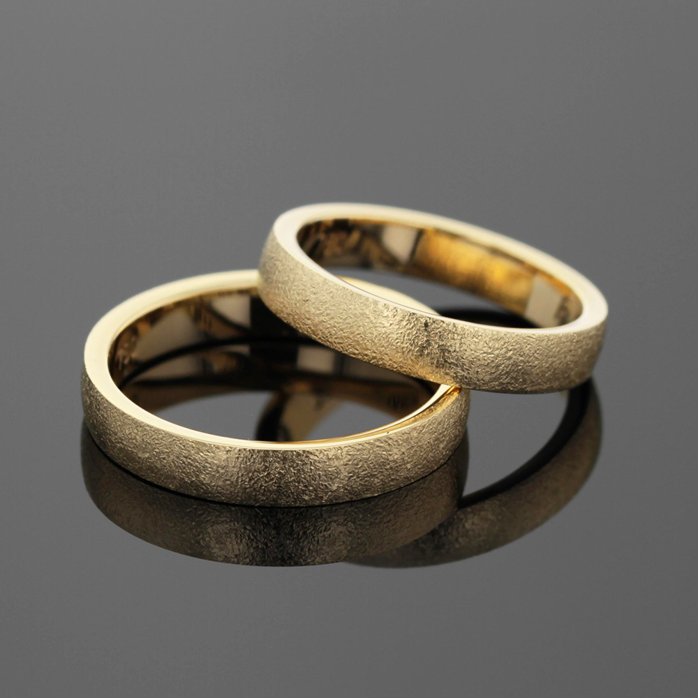 Ice brushed wedding bands in yellow gold