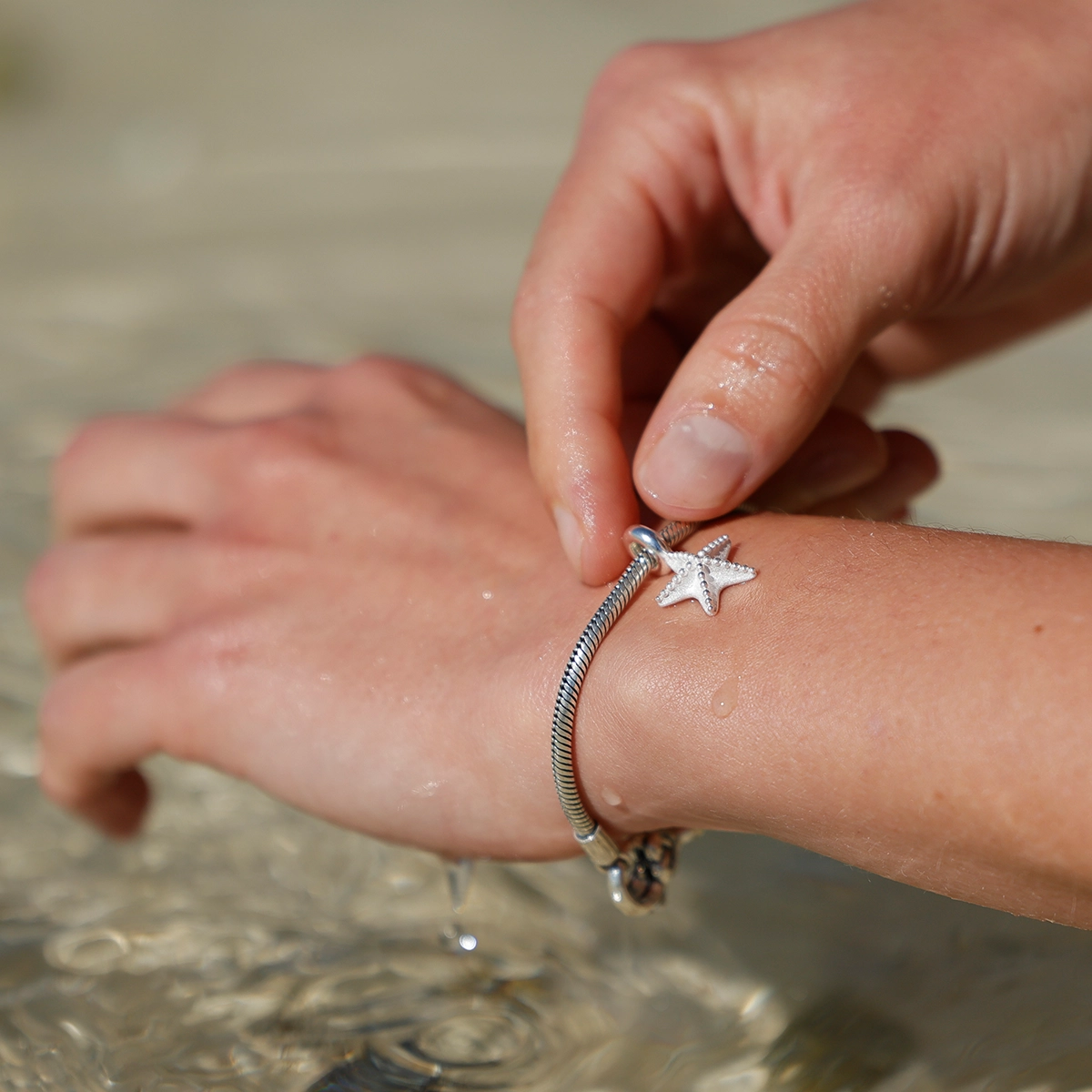 Seastar charm in silver
