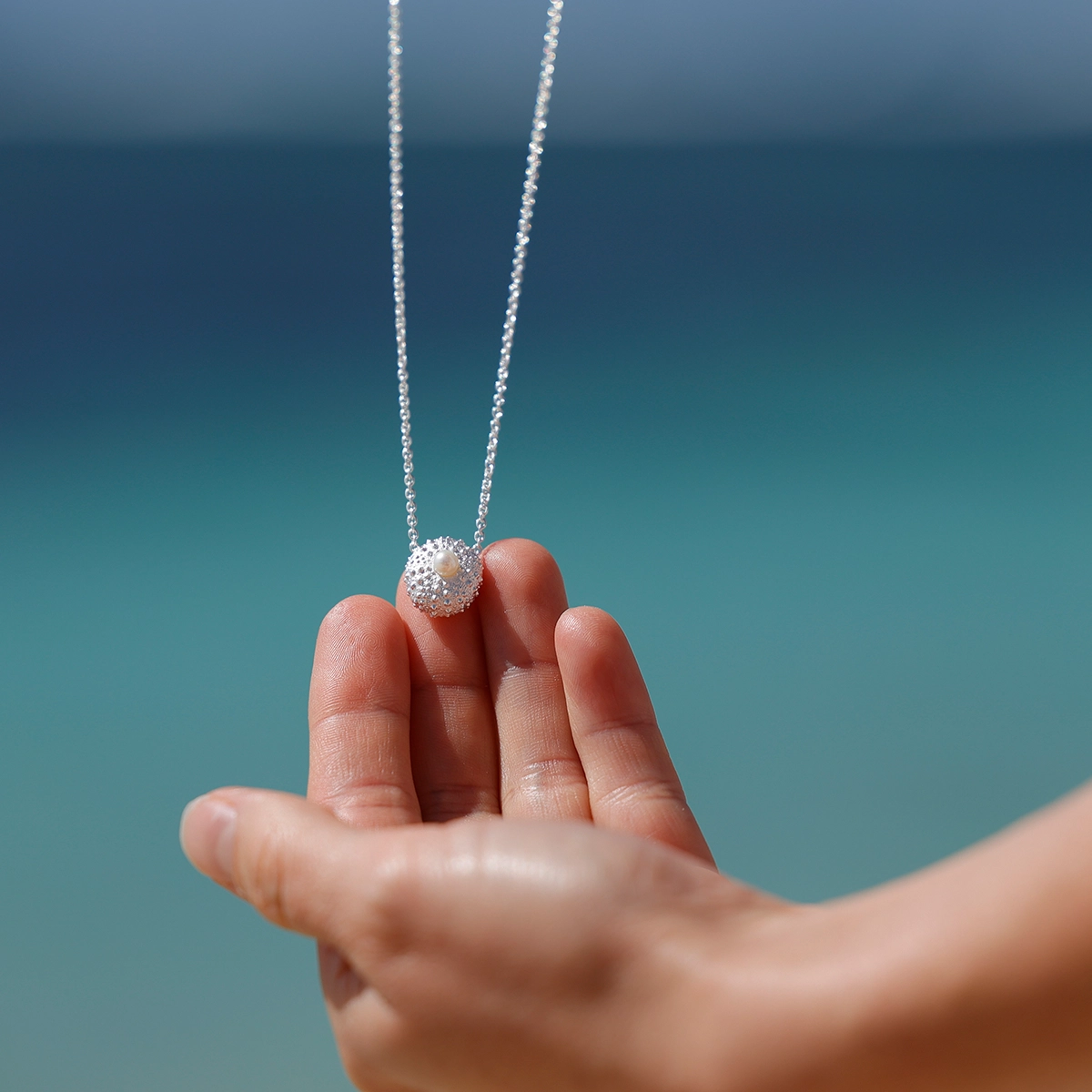 Silver sea urchin pendant with a freshwater pearl