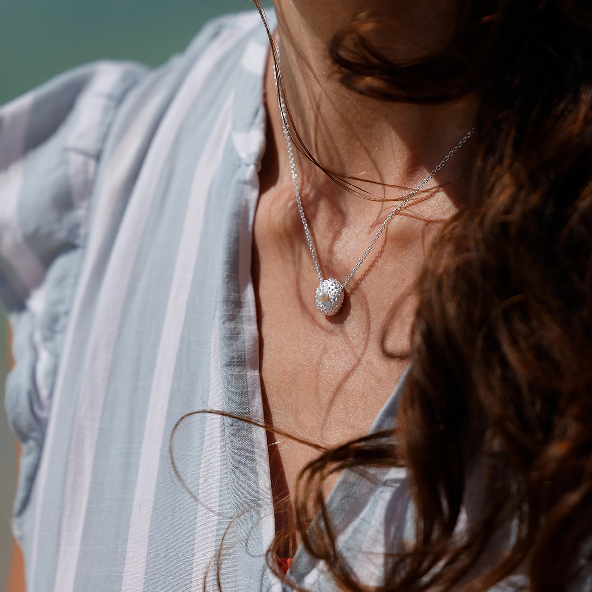 Silver sea urchin pendant with a freshwater pearl